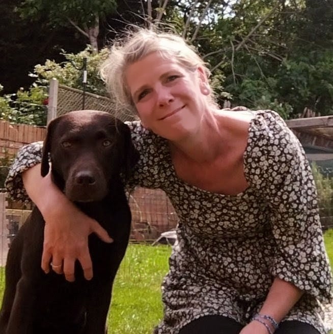 Deb dog behaviourist pictured with her labrador dog