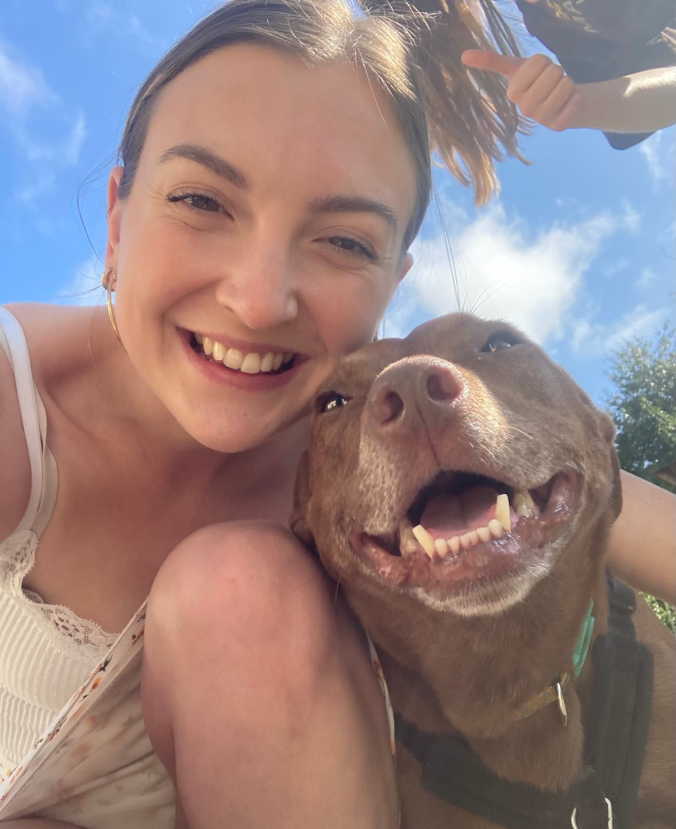 Photo of behaviourist and dog trainer Emily with her pet Staffy