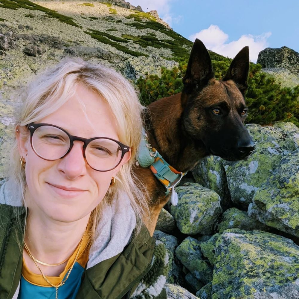 Maarja, our dog trainer in Bristol pictured with her rescued Malinois
